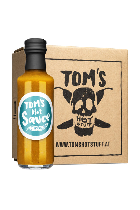 Flasche Hot Sauce „Superbloom" mit türkisem Etikett auf weißem Hintergrund mit Kartonschachtel.